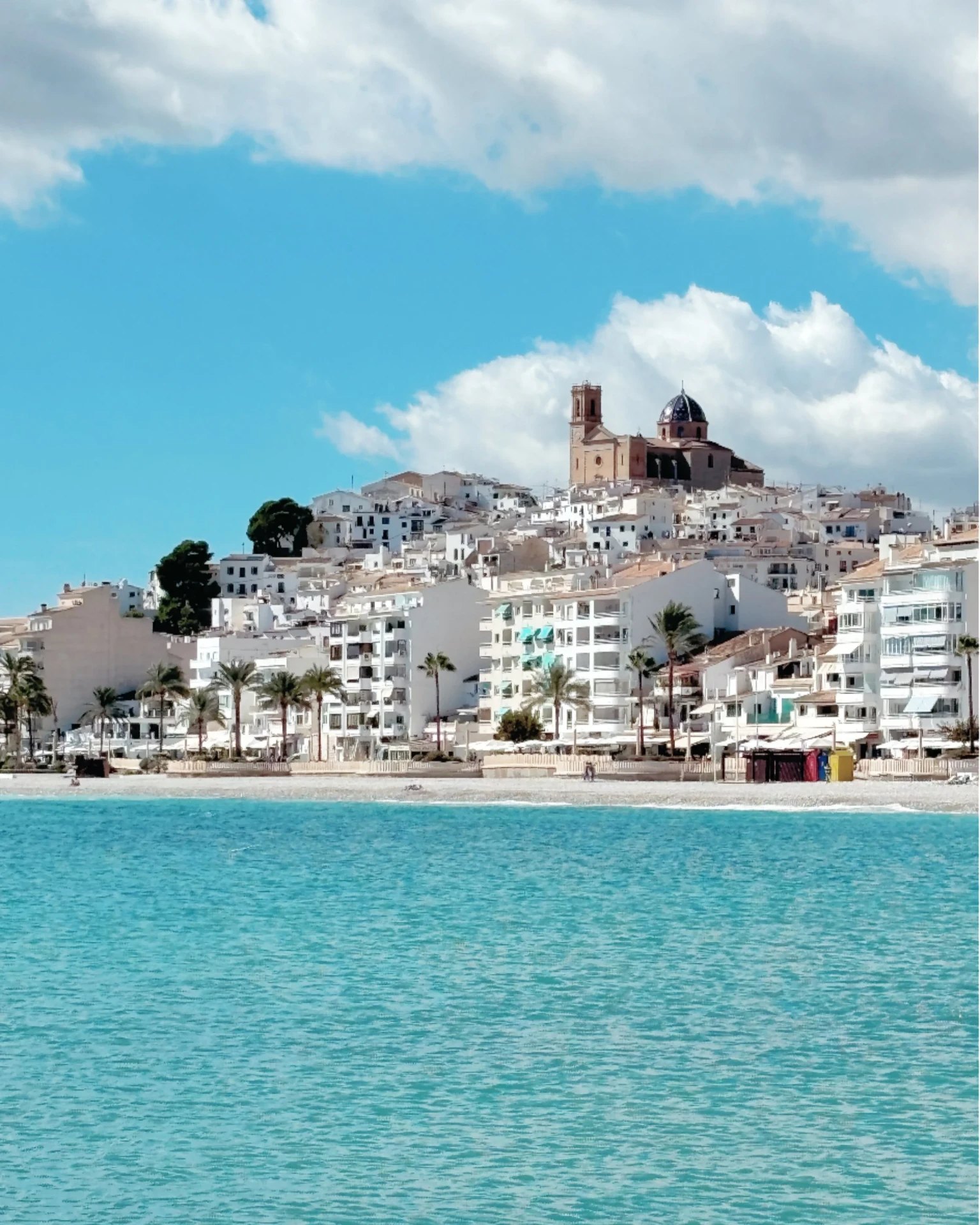 Whitewashed old town of Altea with its blue-domed church above a turquoise bay