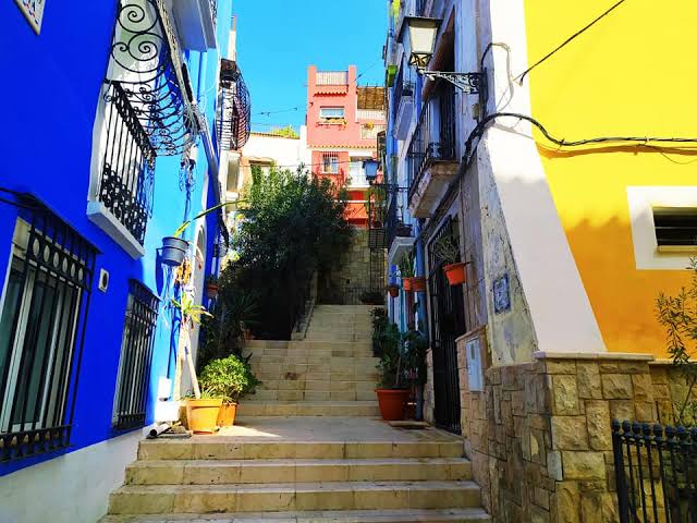 Barrio de Santa Cruz Alicante colourful stairs and houses leading up to the castle